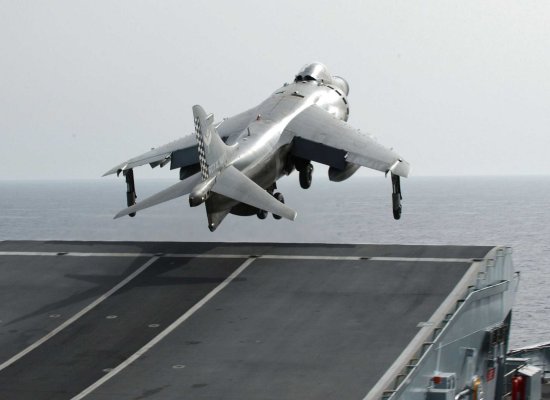 Sea Harrier takes off using the ski jump aboard a British aircraft carrier