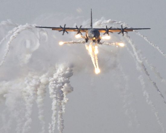 Flares ejected by a C-130 Hercules military transport