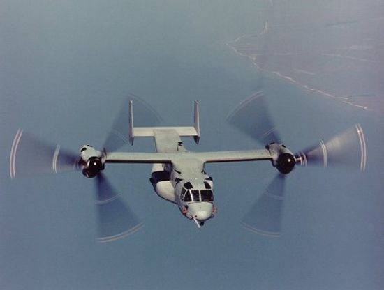 Blade markings visible on a V-22 in flight