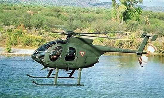 Brightly colored markings on the main and tail rotors of an MD 500 helicopter