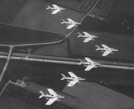 Military aircraft flying in a V-formation