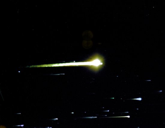 Apollo 8 capsule photographed during re-entry